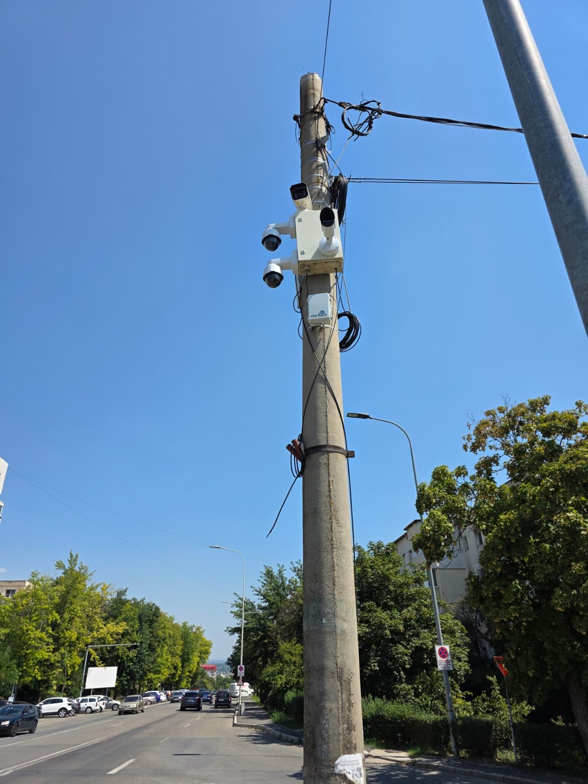 Air monitoring station mounted on a pole, above a boulevard in Tulcea